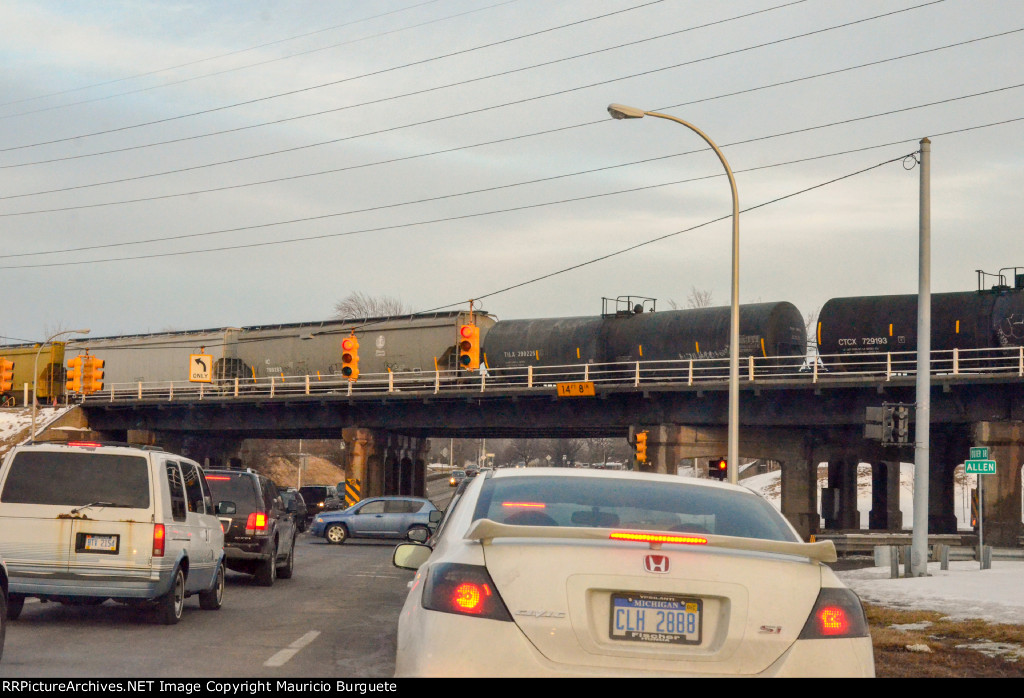 TILX Tank Car and Covered Hoppers over the bridge